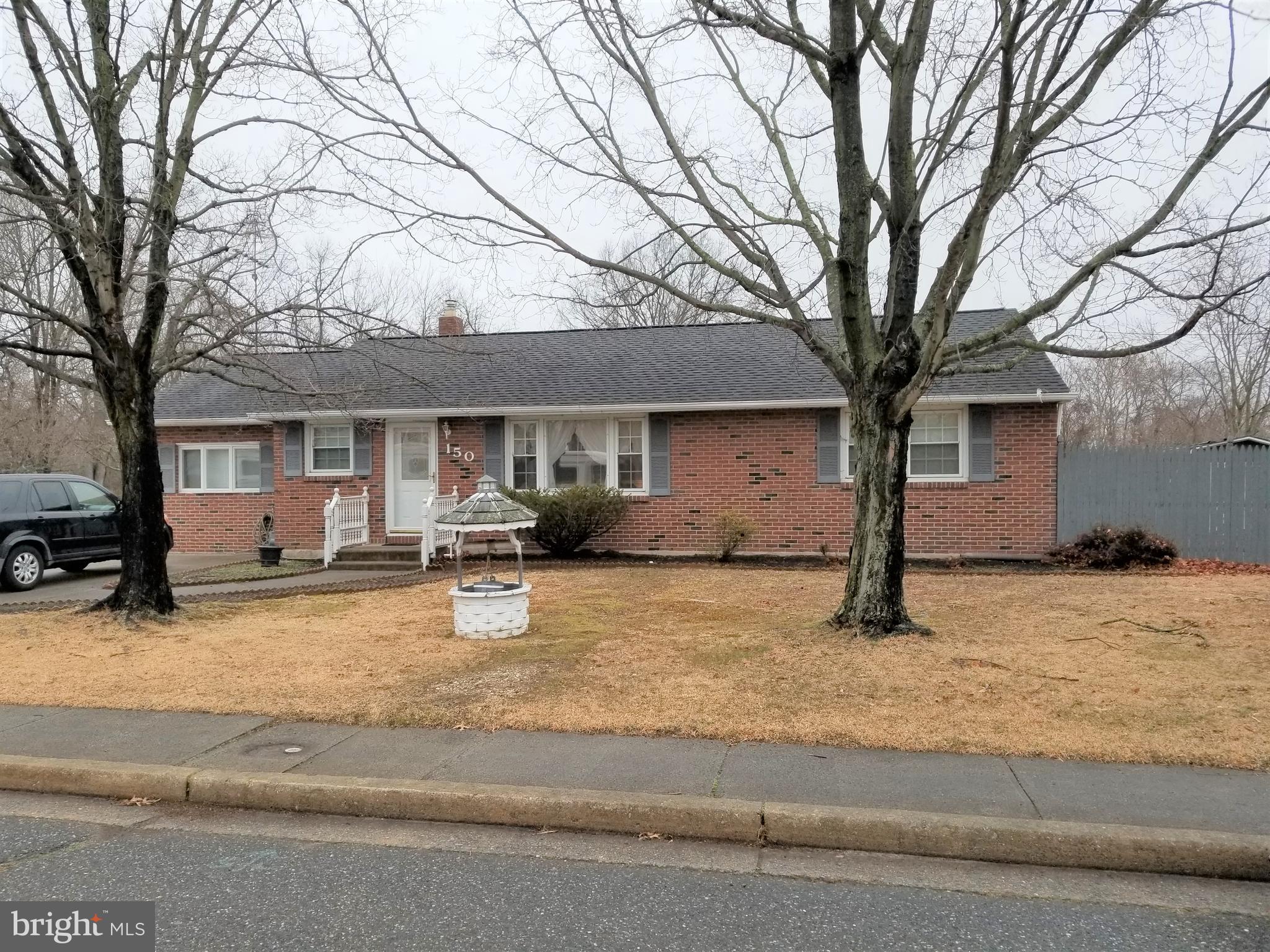 150 Kansas Road Pennsville, NJ 08070 - Photo 1 of 20 a house that has a tree in front of it