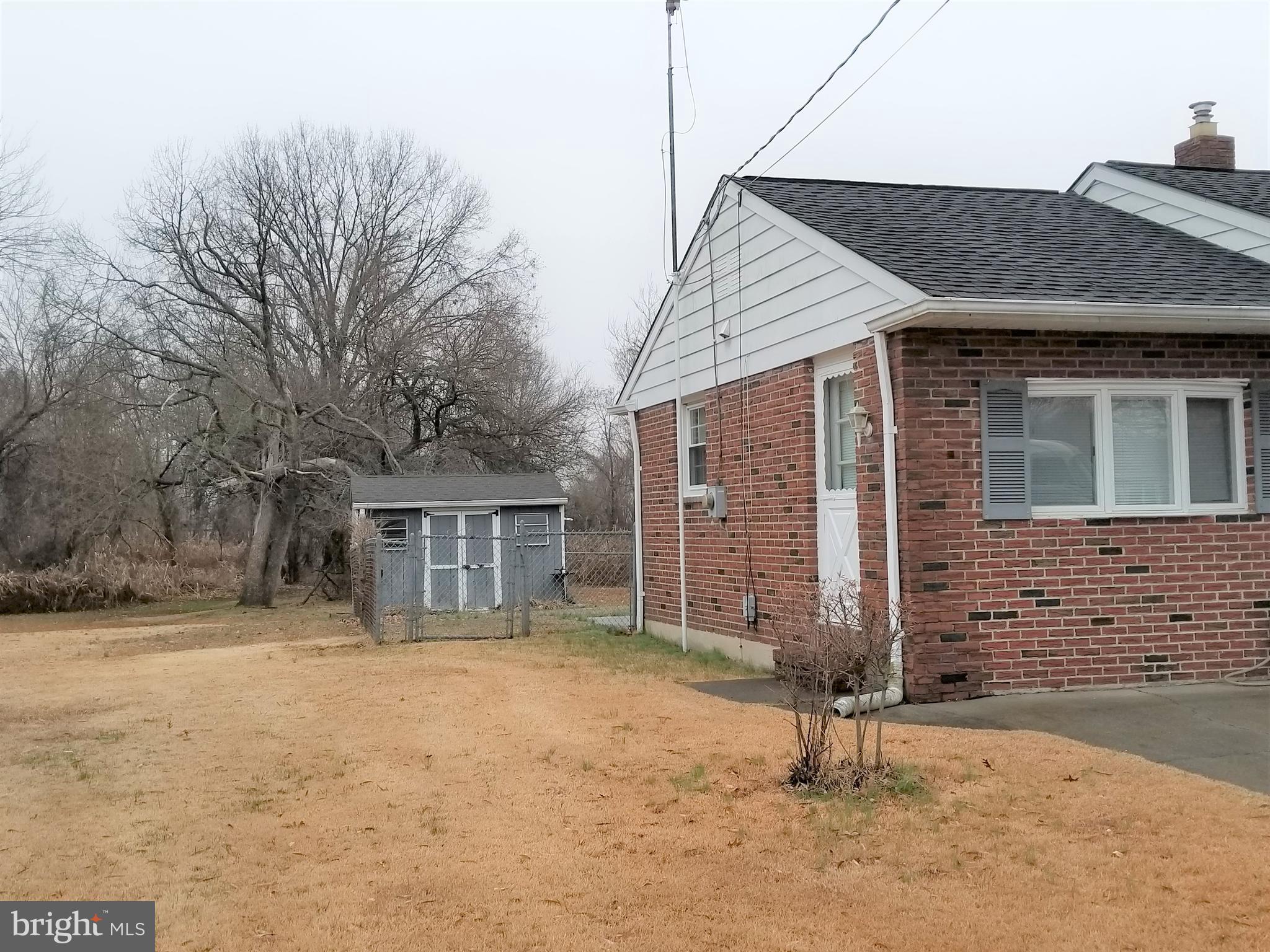 150 Kansas Road Pennsville, NJ 08070 - Photo 3 of 20 a backyard of a house with seating space