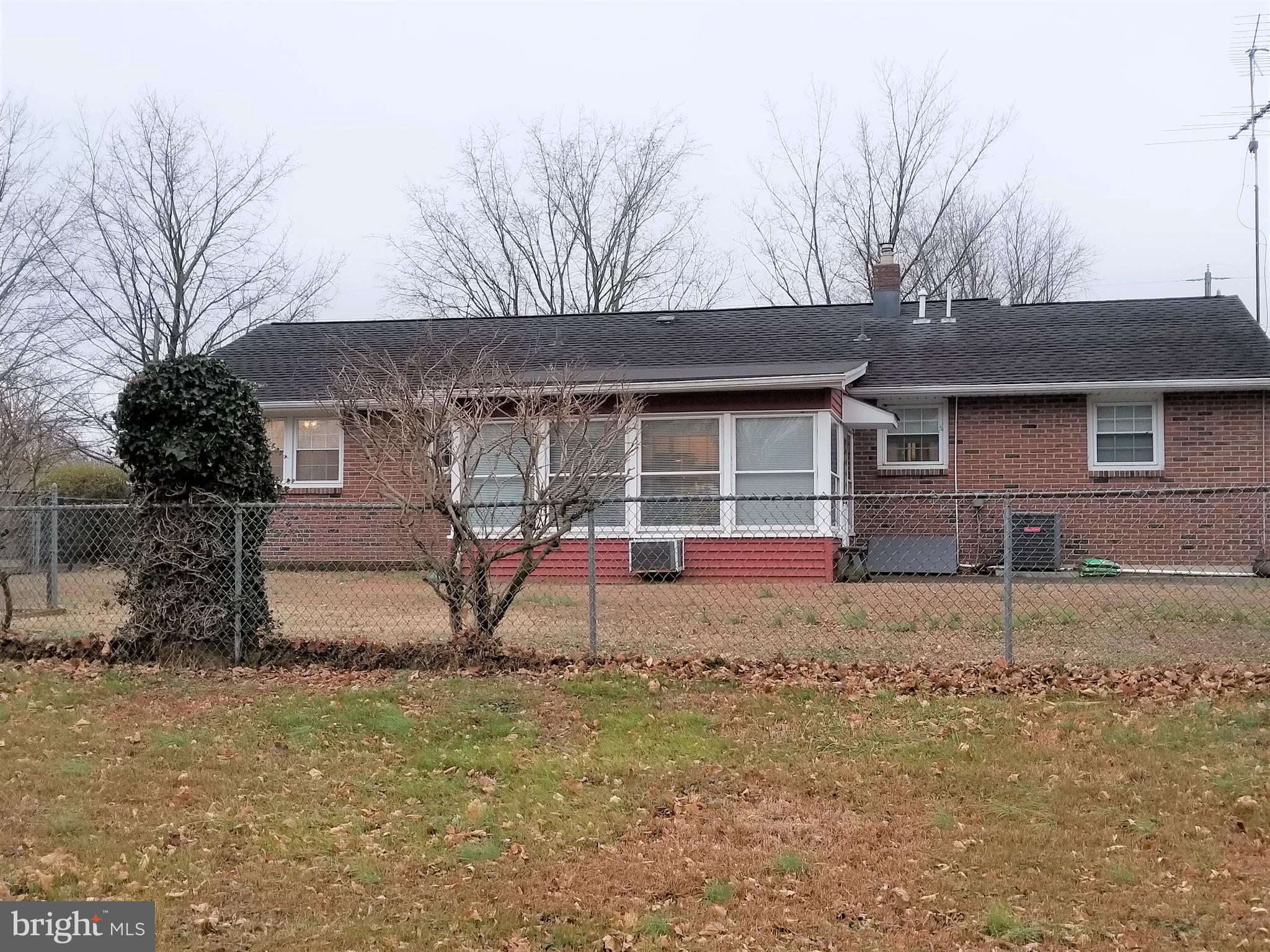 150 Kansas Road Pennsville, NJ 08070 - Photo 5 of 20 a view of a house with large windows