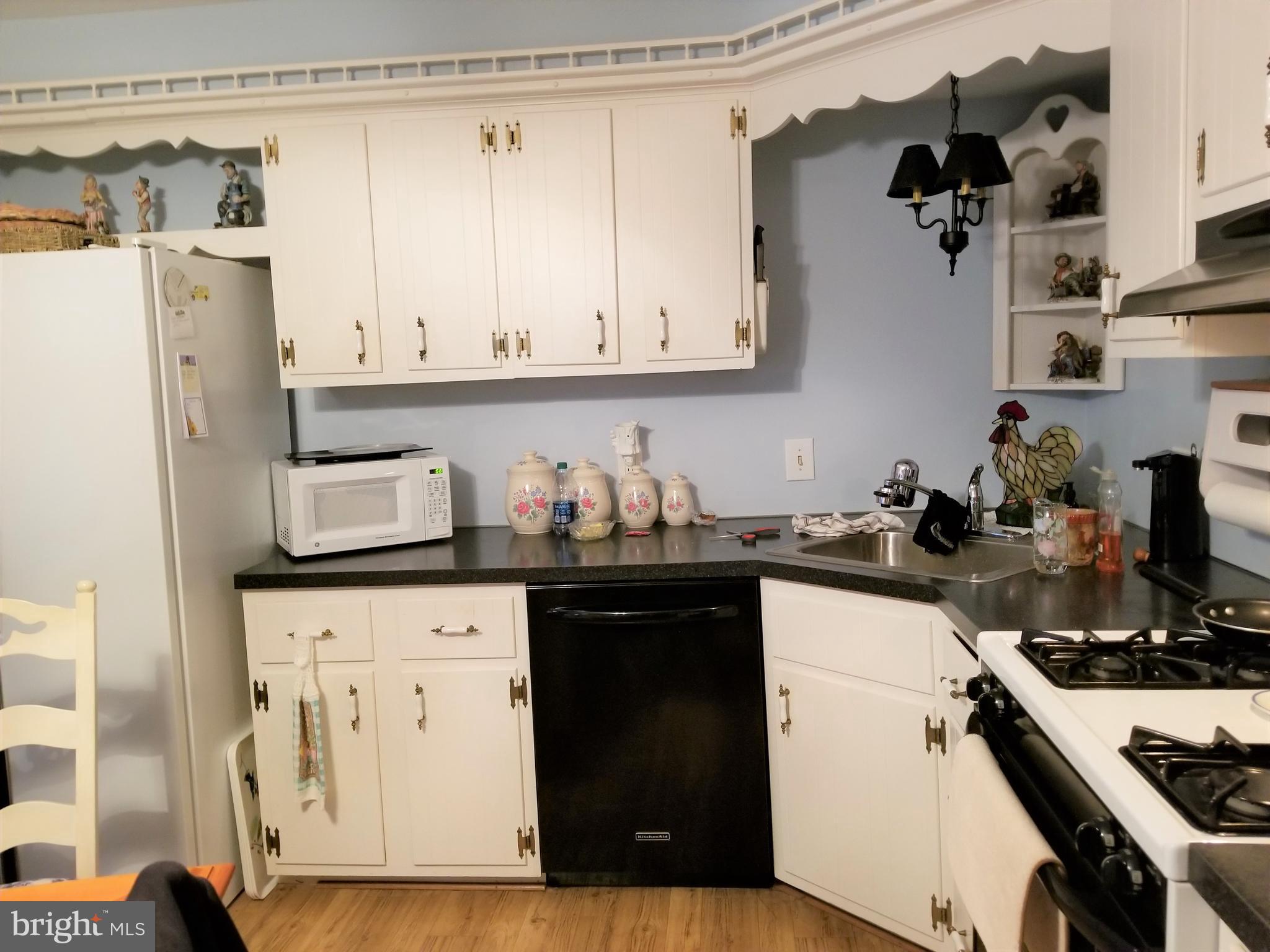 150 Kansas Road Pennsville, NJ 08070 - Photo 6 of 20 a kitchen with stainless steel appliances granite countertop a refrigerator and stove