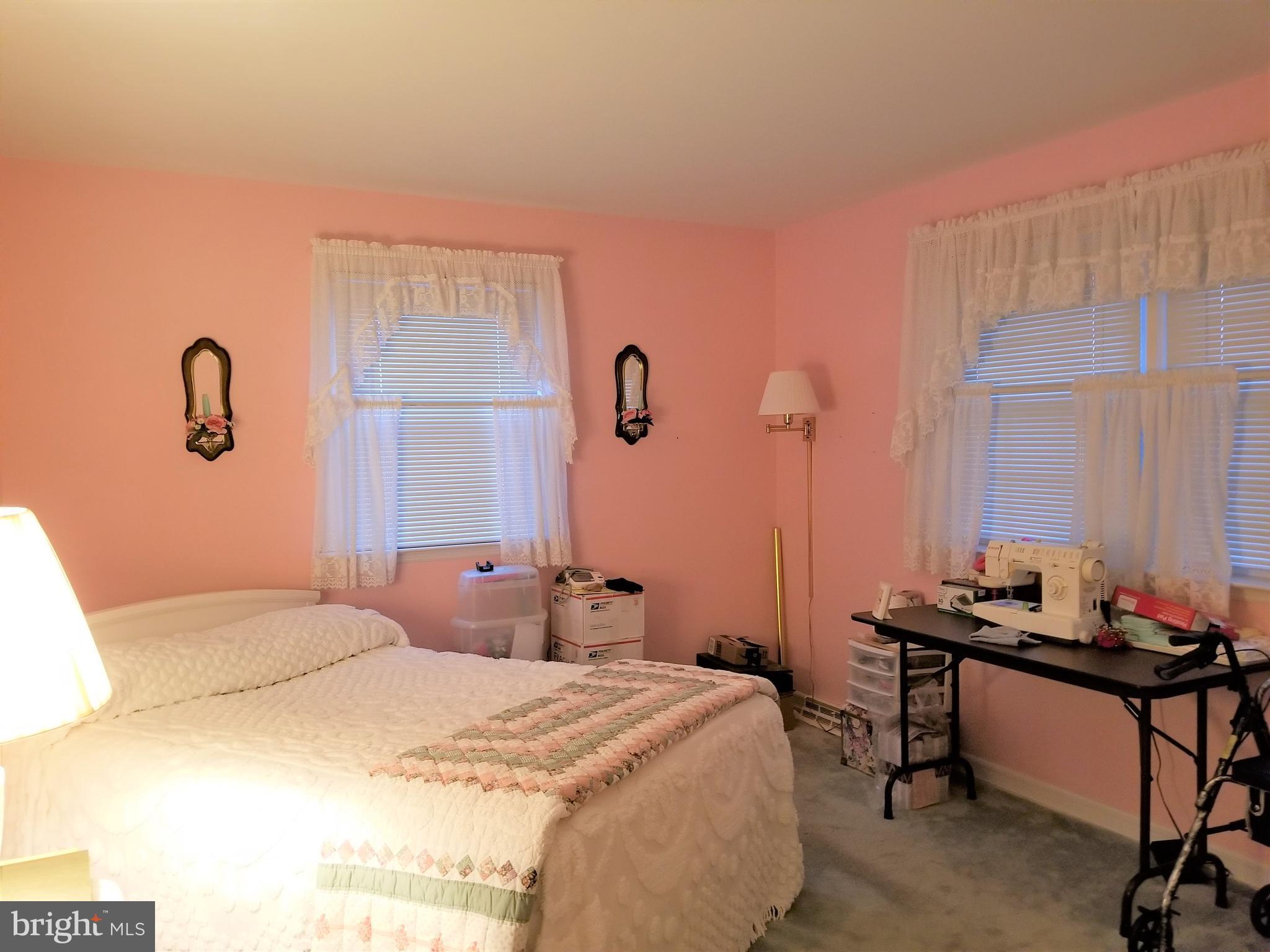 150 Kansas Road Pennsville, NJ 08070 - Photo 10 of 20 a bedroom with a bed and a table
