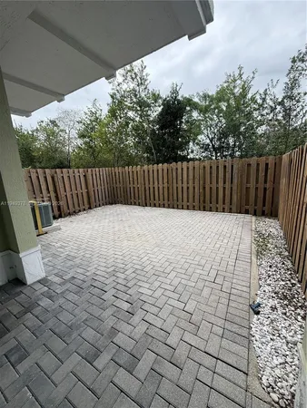 a bathroom with a sink vanity mirror and toilet
