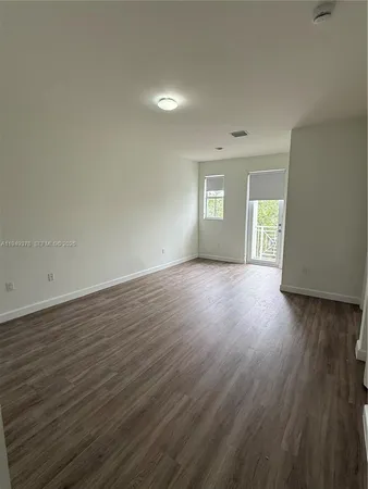 a white toilet sitting next to a white sink