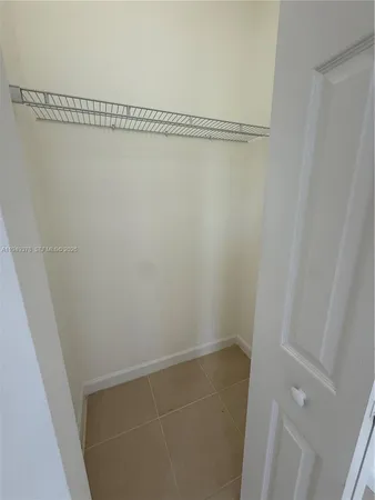 a view of an empty room with windows