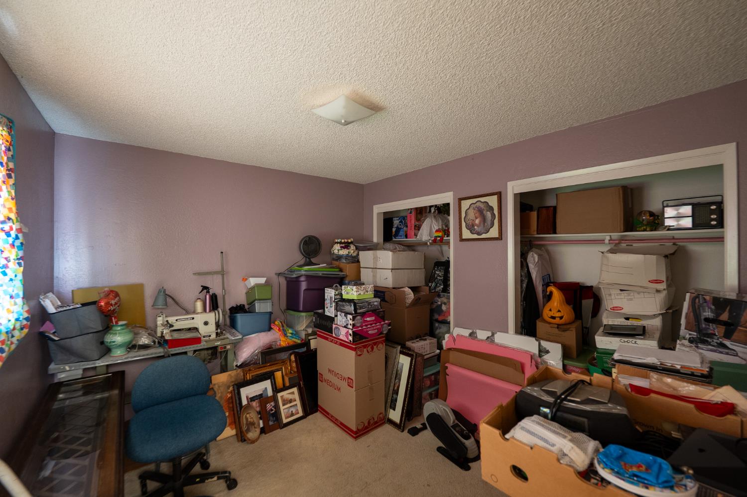 859 11th Street Sanger, CA 93657 - Photo 17 of 28 a room with furniture and a gym machine