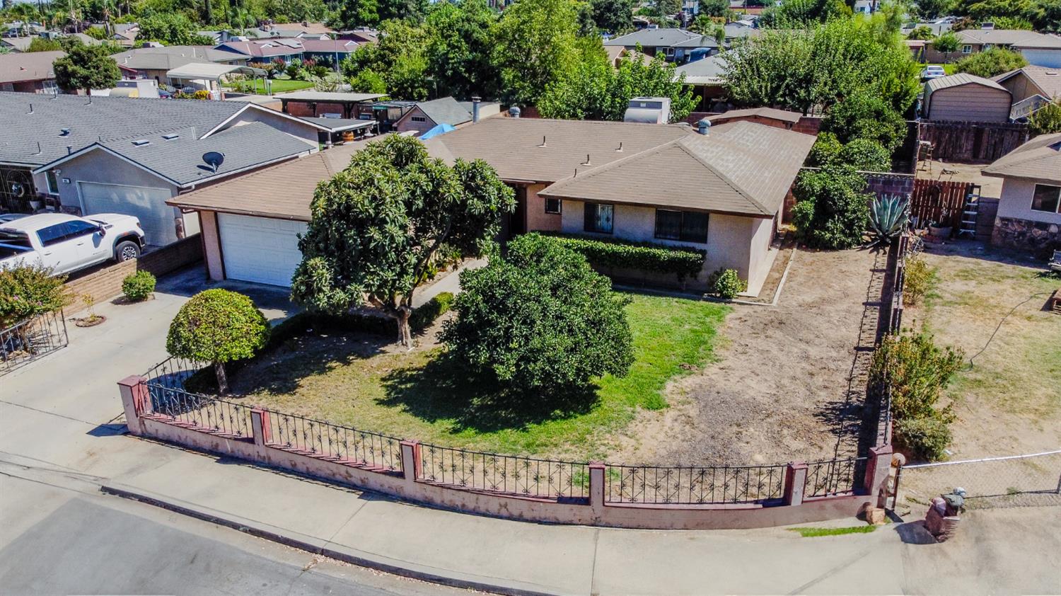859 11th Street Sanger, CA 93657 - Photo 2 of 28 an aerial view of a house