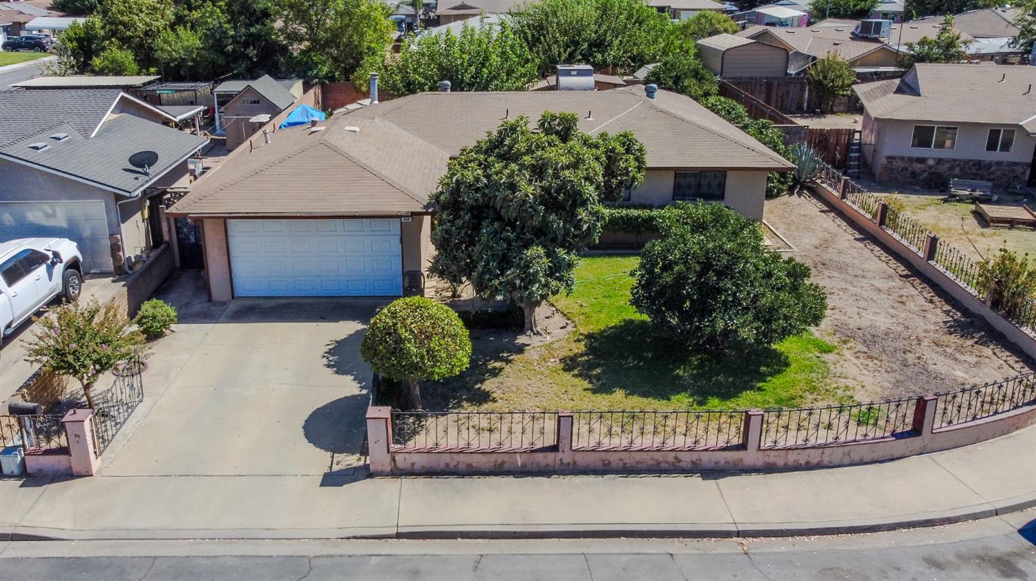 859 11th Street Sanger, CA 93657 - Photo 22 of 28 an aerial view of a house