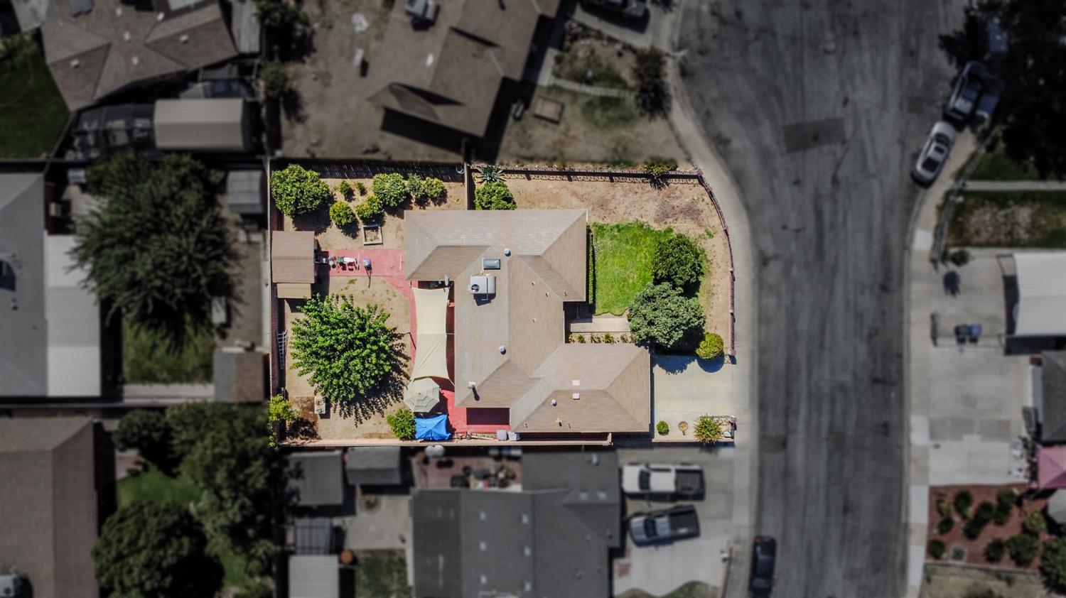 859 11th Street Sanger, CA 93657 - Photo 25 of 28 an aerial view of a house with outdoor space