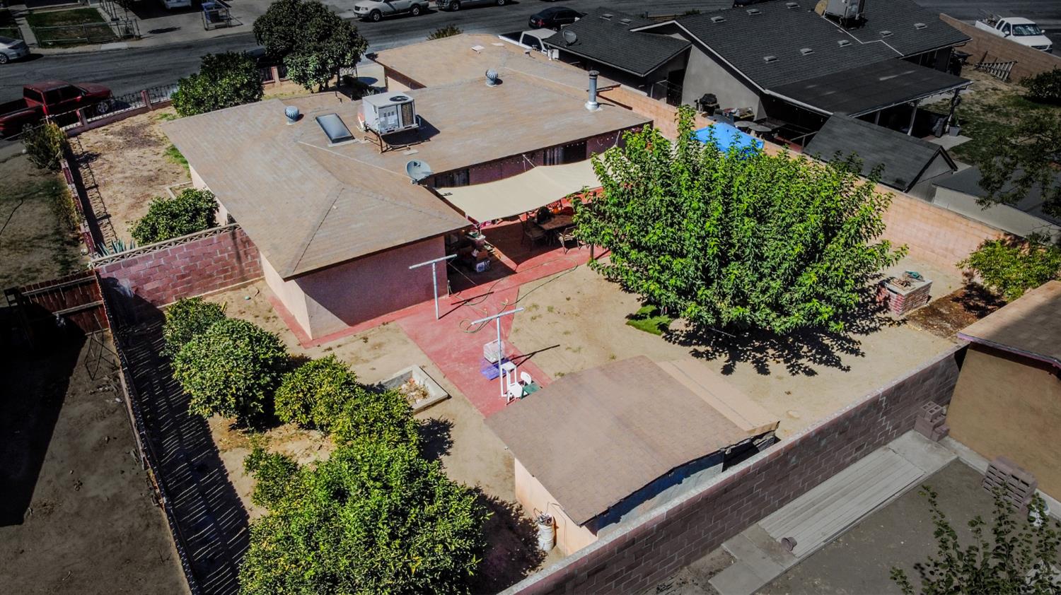 859 11th Street Sanger, CA 93657 - Photo 27 of 28 an aerial view of a house with a yard