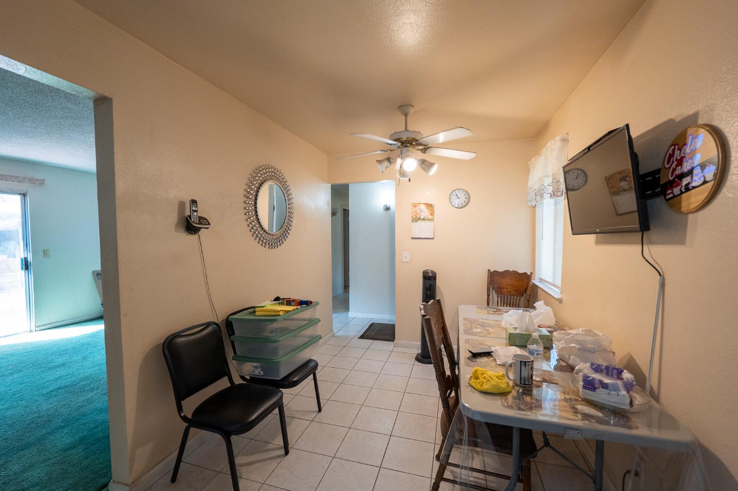 859 11th Street Sanger, CA 93657 - Photo 5 of 28 a living room with furniture and chandelier