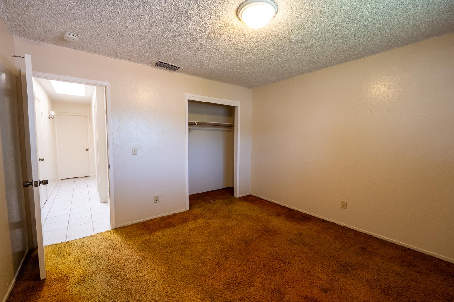 859 11th Street Sanger, CA 93657 - Photo 9 of 28 an empty room with closet area