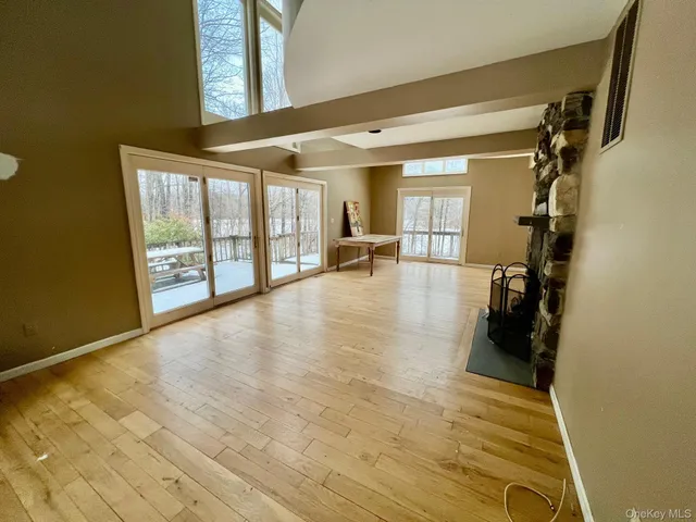 a view of yard covered with snow in front of house