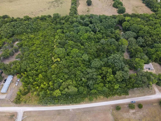 an outdoor view of house with green space