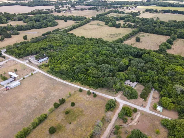 an aerial view of house with yard