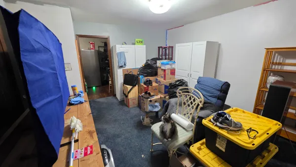 a bedroom with furniture and a window