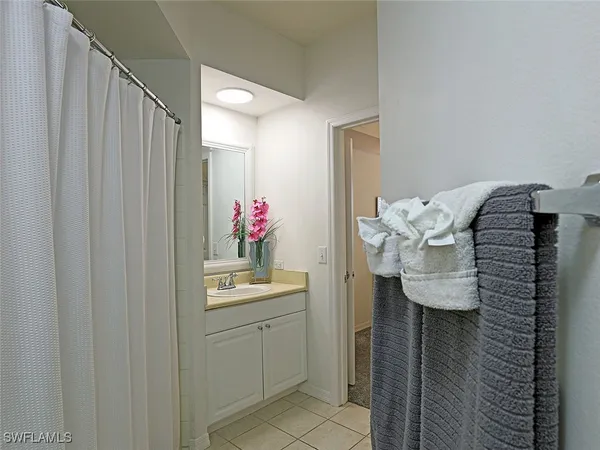 a bedroom with a bed and chair