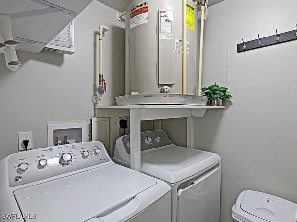 a front view of multiple houses with yard