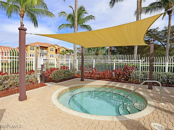 a swimming pool with outdoor seating and yard