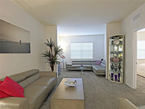 a living room with furniture and window