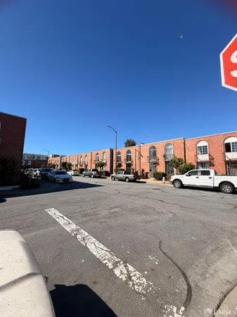 a view of a city street with cars