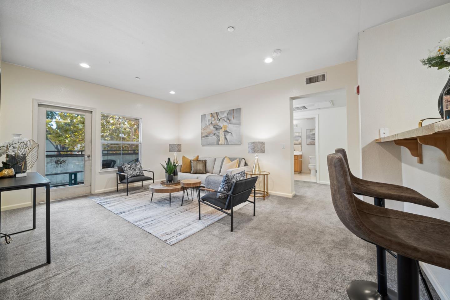 a living room with furniture and a large window
