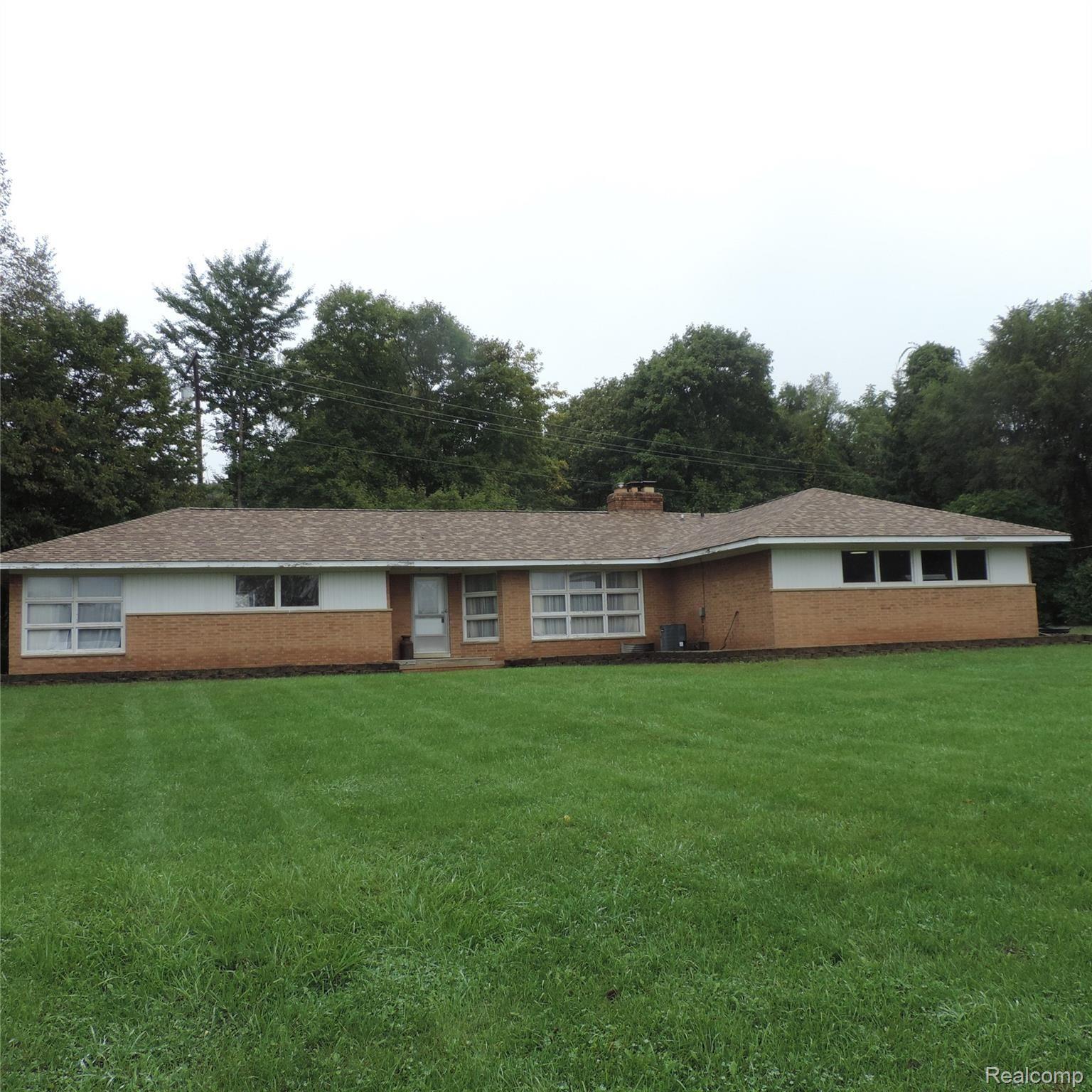 1650 West Predmore Road Oakland, MI 48363 - Photo 1 of 19 Oakland Township solid brick ranch on 6.7 acres backs to Addison Oaks park. open in the front and towering trees in back for privacy. hard wood floors throughout, Corian in the kitchen & bath. new roof, new well. quick possession. 2 out buildings