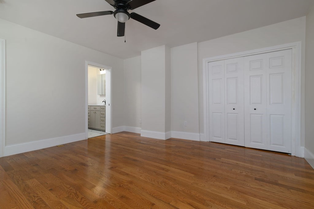 382-384 Adams Street, Unit 3841 Boston, MA 02122 - Photo 11 of 16 a view of an empty room with wooden floor