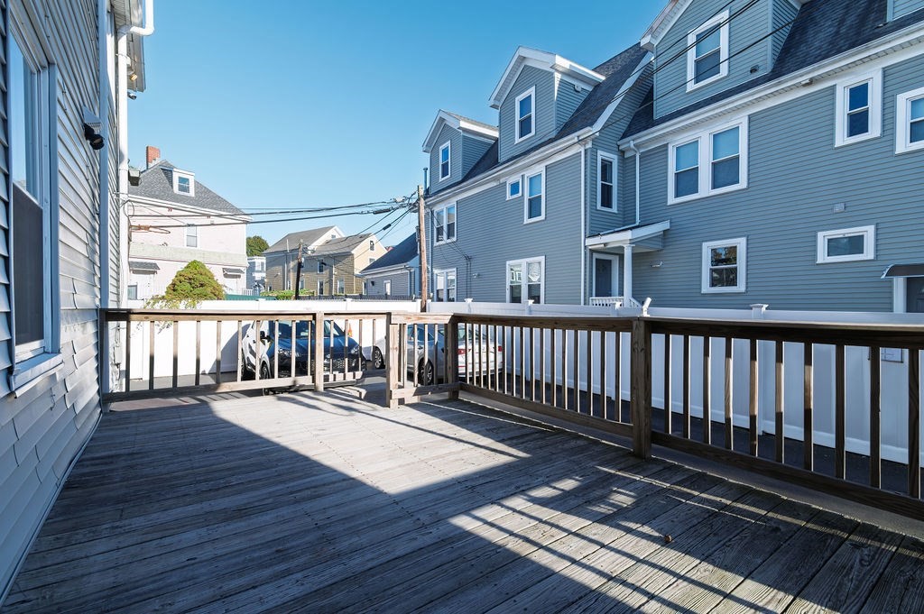 382-384 Adams Street, Unit 3841 Boston, MA 02122 - Photo 16 of 16 a balcony with wooden floor