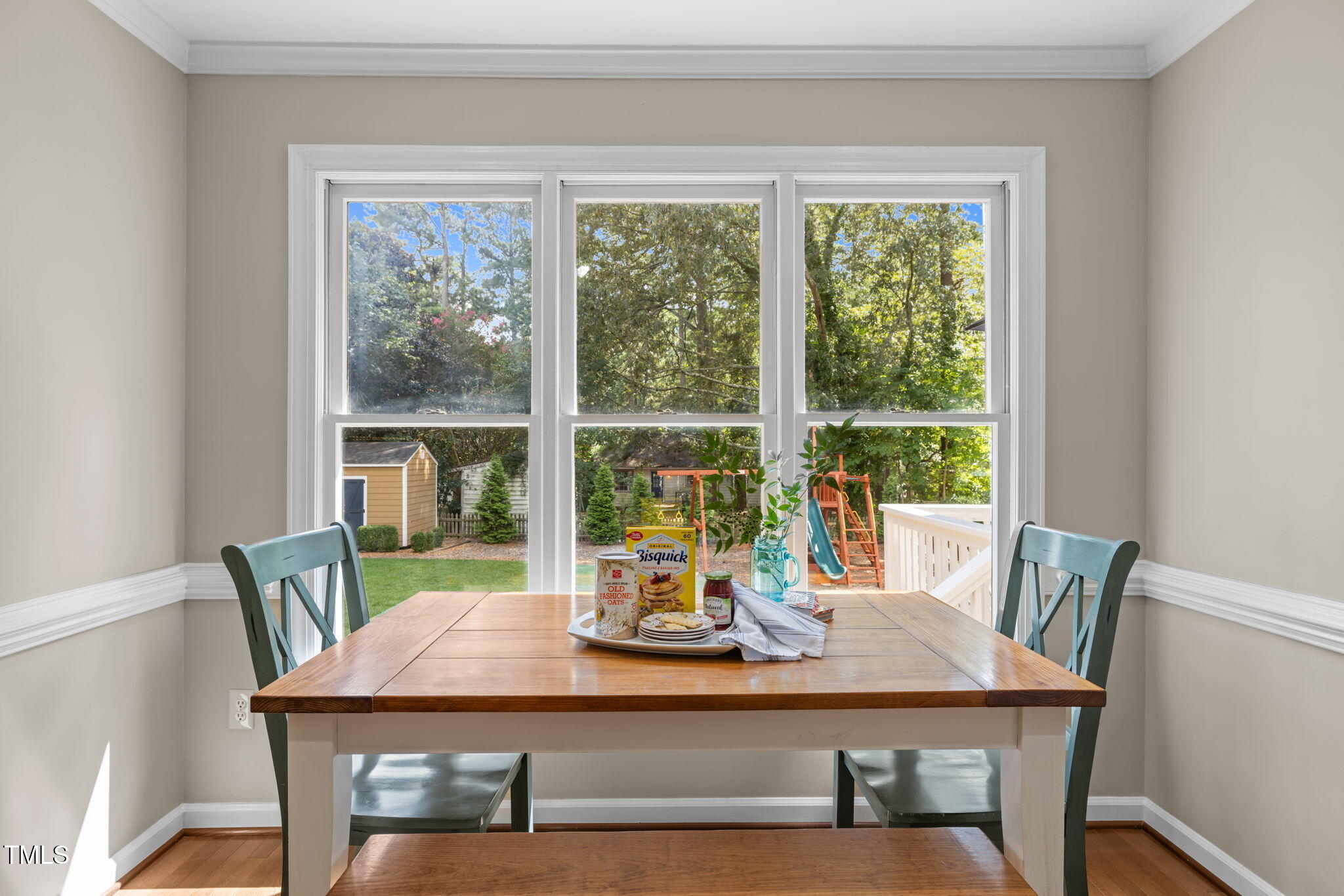 5909 Stable Court Raleigh, NC 27612 - Photo 15 of 45 a view of a dining room with furniture window and wooden floor