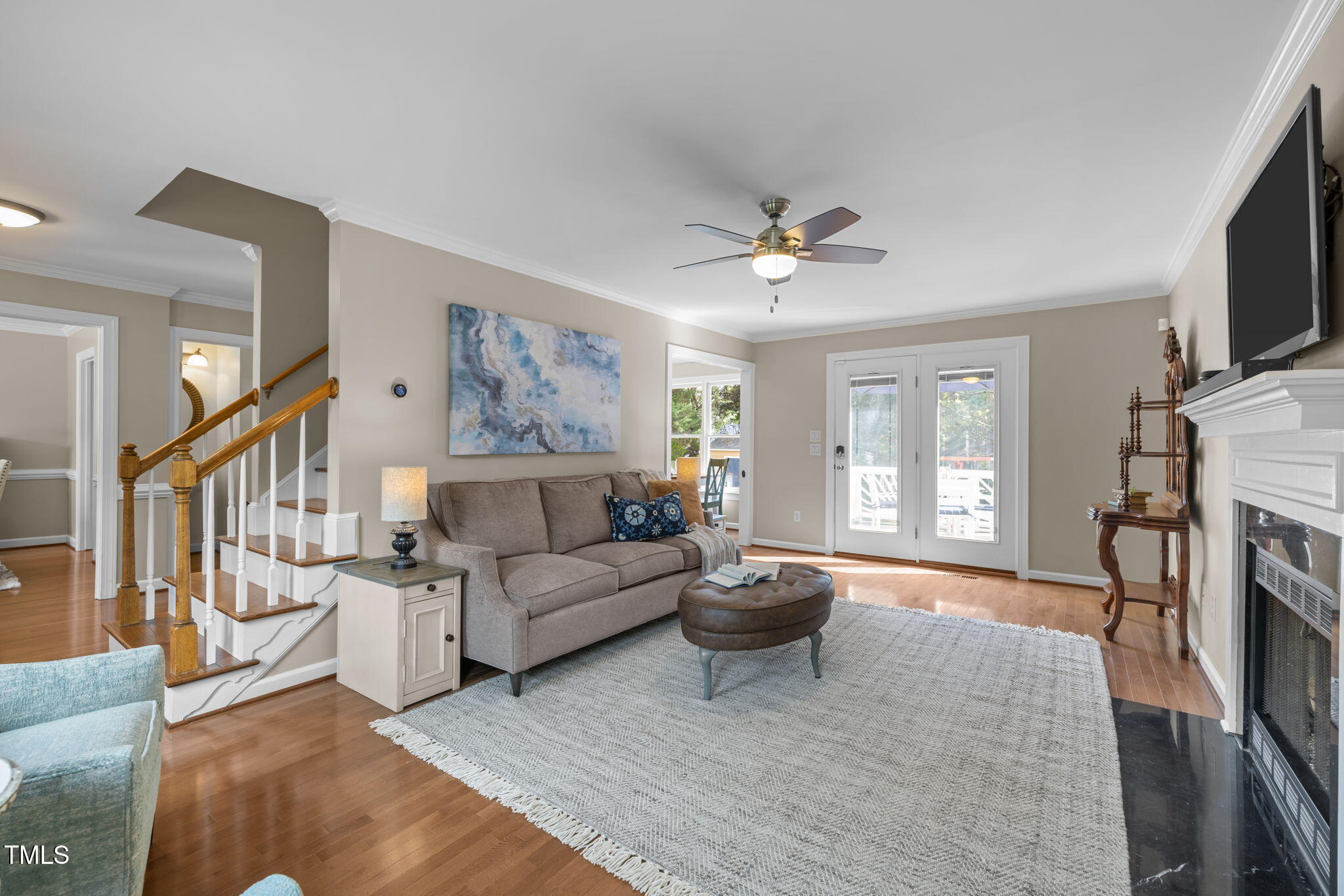 5909 Stable Court Raleigh, NC 27612 - Photo 20 of 45 a living room with furniture and a flat screen tv