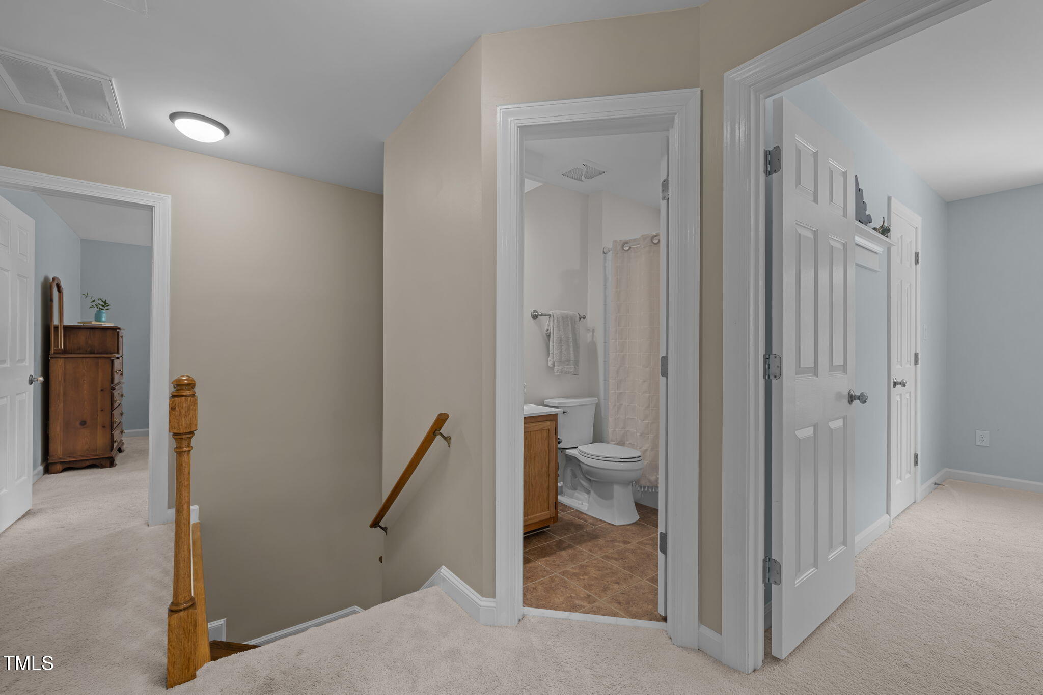 5909 Stable Court Raleigh, NC 27612 - Photo 23 of 45 a view of a bathroom from a hallway