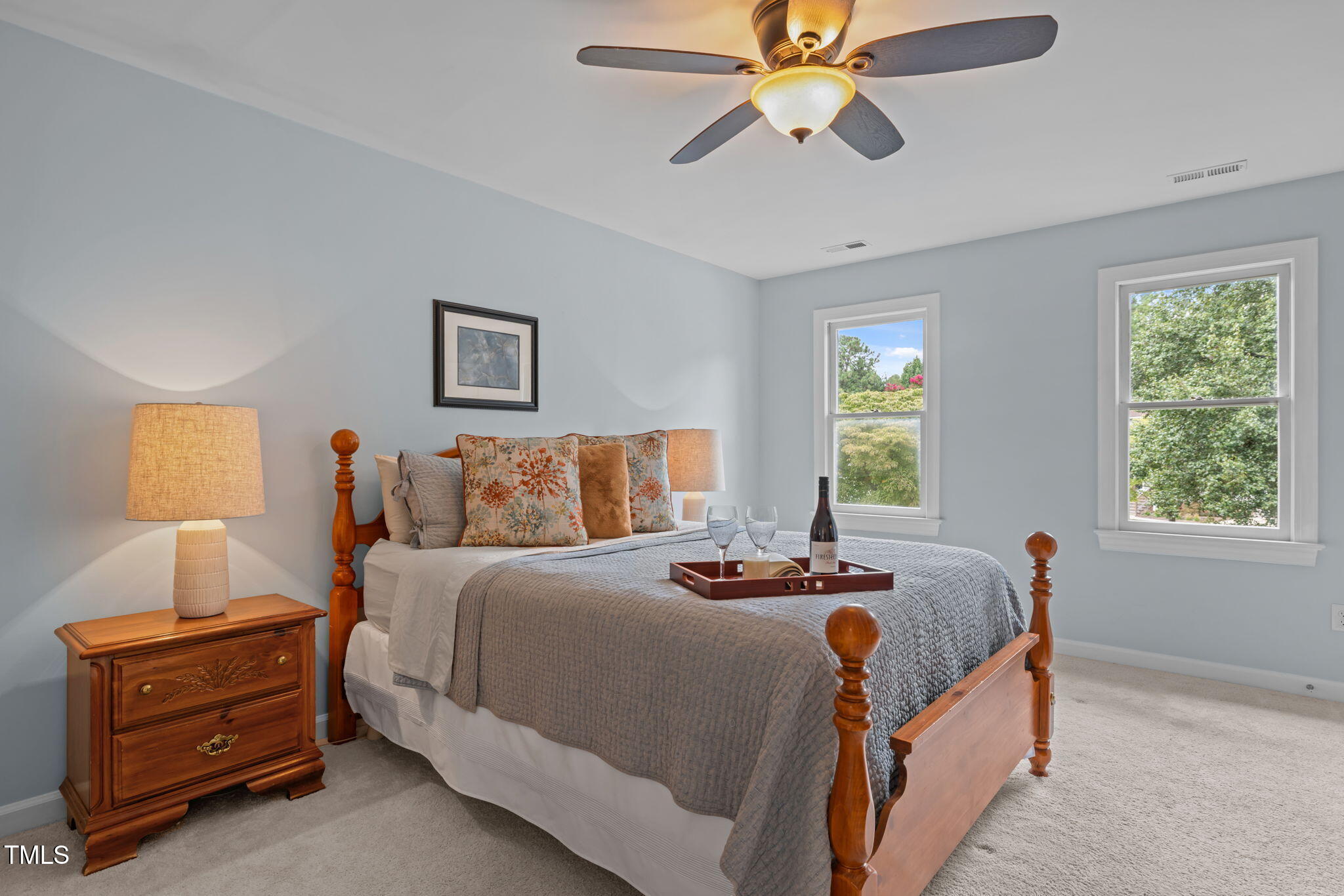 5909 Stable Court Raleigh, NC 27612 - Photo 24 of 45 a bedroom with bed and window