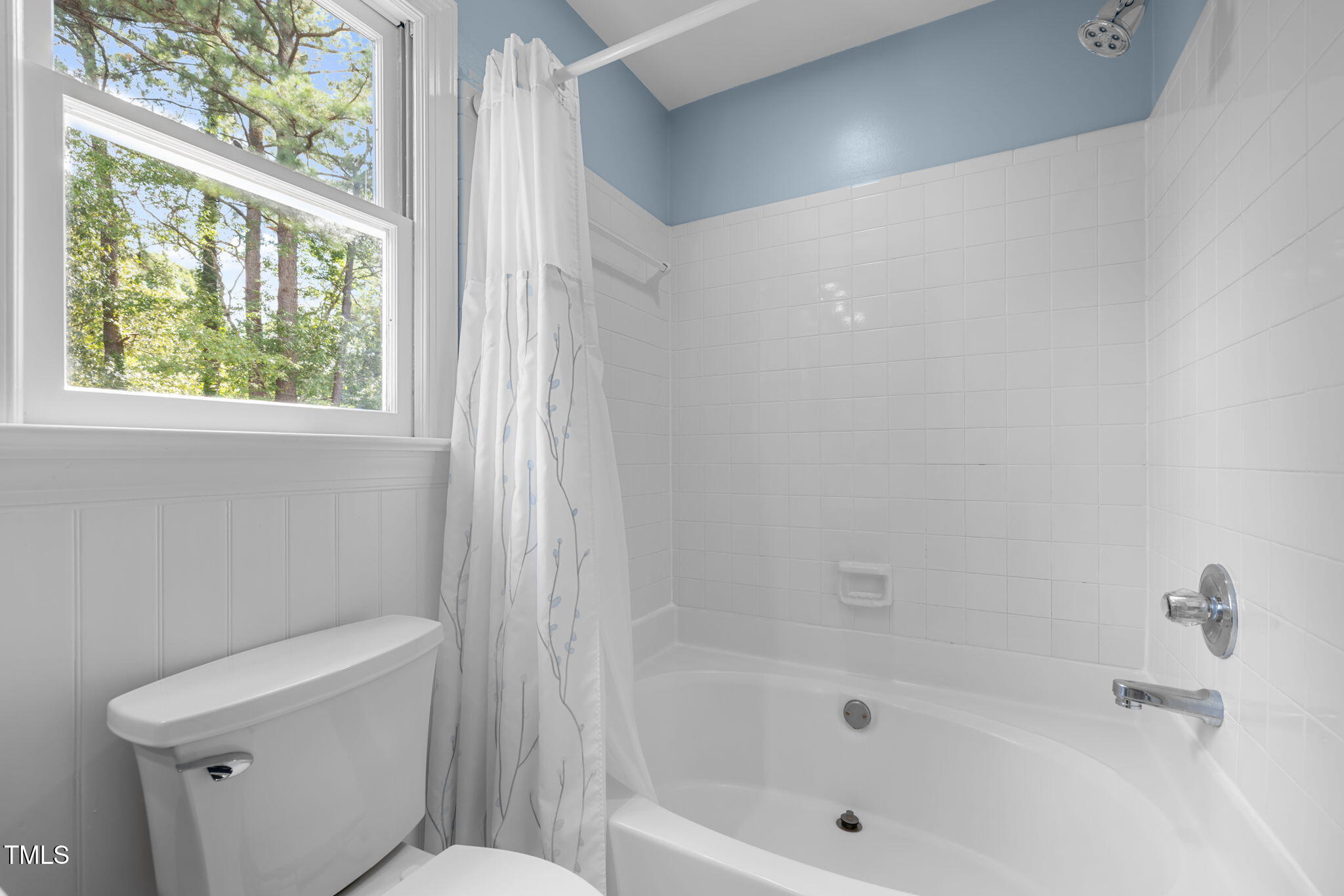 5909 Stable Court Raleigh, NC 27612 - Photo 28 of 45 a white bath tub sitting next to a toilet