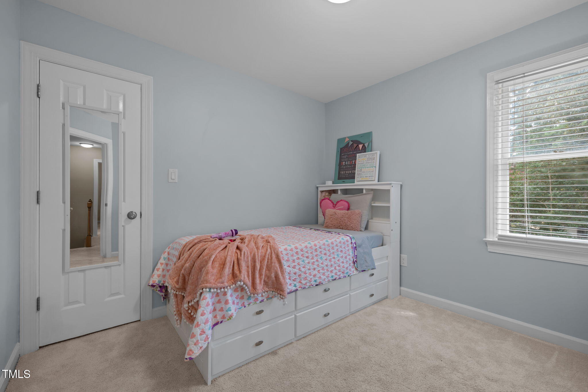 5909 Stable Court Raleigh, NC 27612 - Photo 33 of 45 a bedroom with a bed and a window