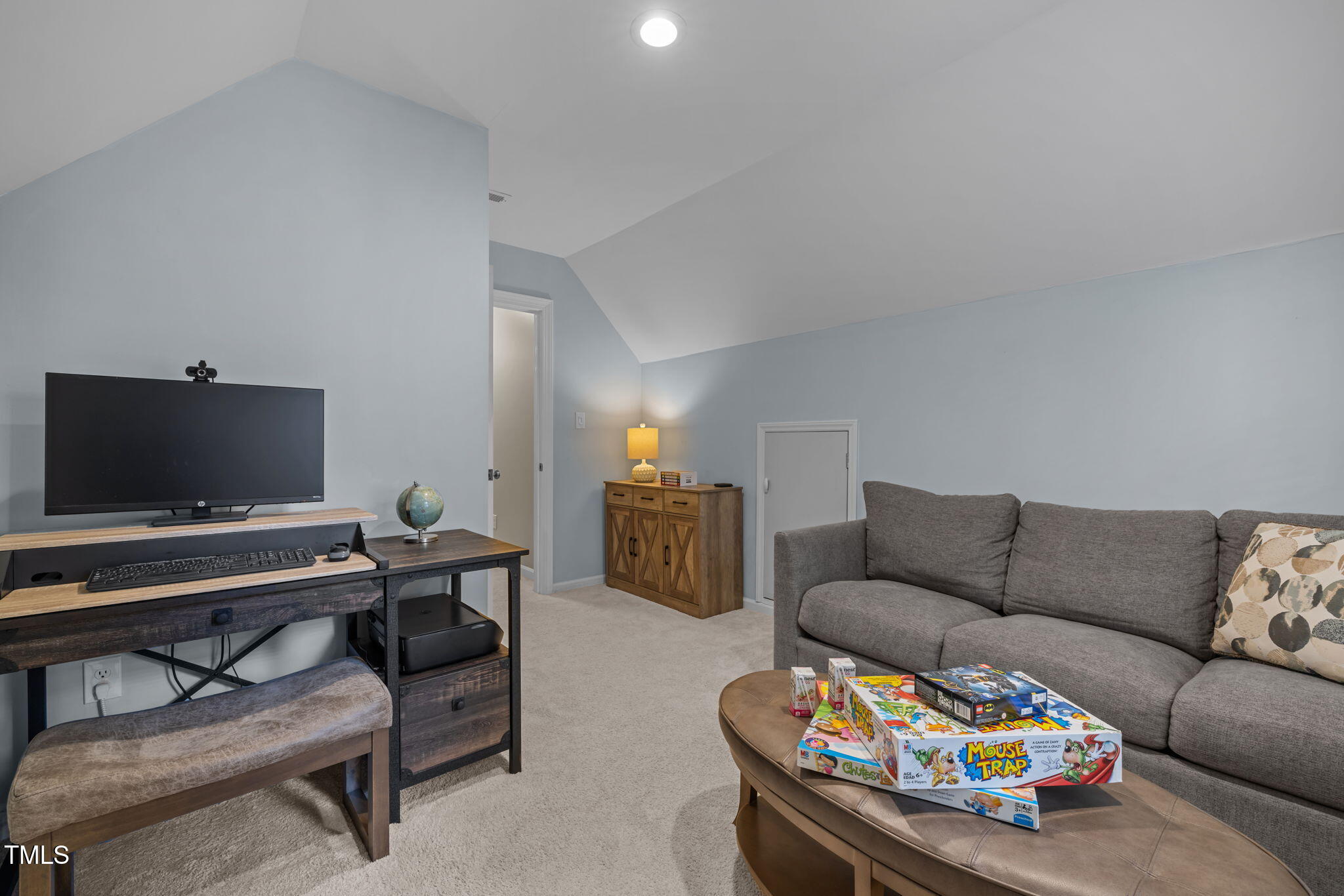 5909 Stable Court Raleigh, NC 27612 - Photo 35 of 45 a living room with furniture and a flat screen tv