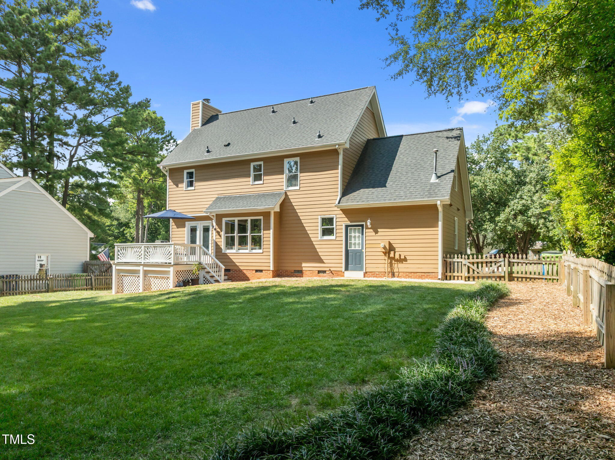 5909 Stable Court Raleigh, NC 27612 - Photo 36 of 45 a view of a house with a yard and sitting area