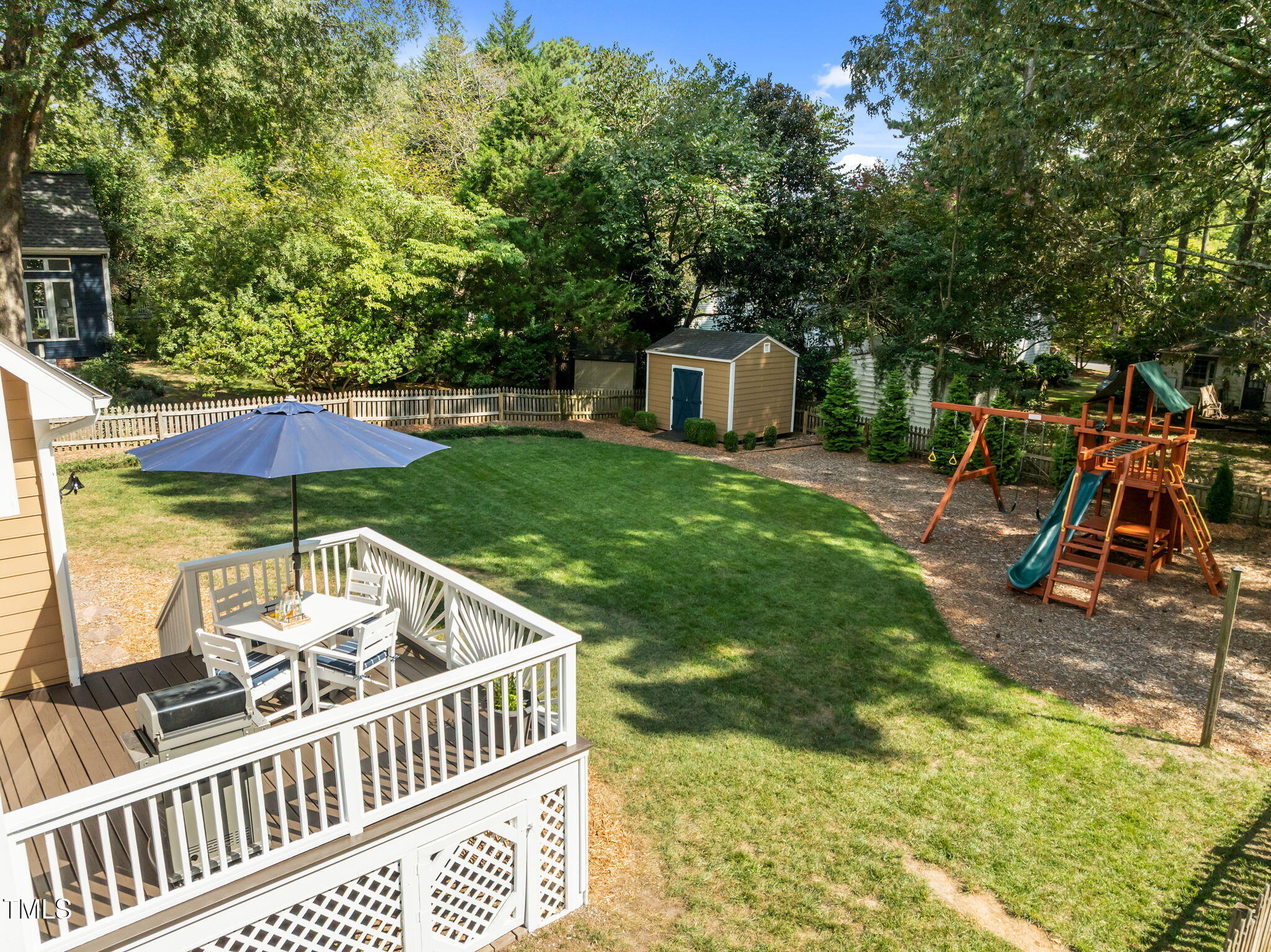 5909 Stable Court Raleigh, NC 27612 - Photo 38 of 45 a view of backyard with deck and chairs