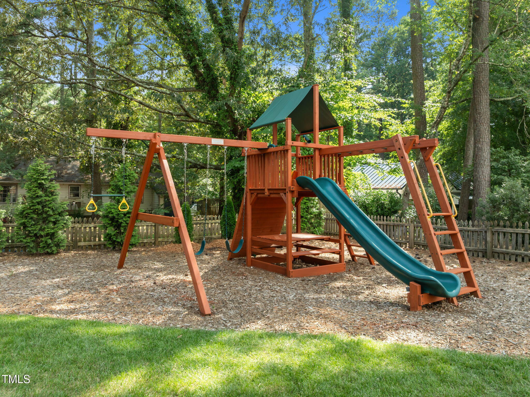 5909 Stable Court Raleigh, NC 27612 - Photo 39 of 45 a backyard of a house with childrens swings and slides