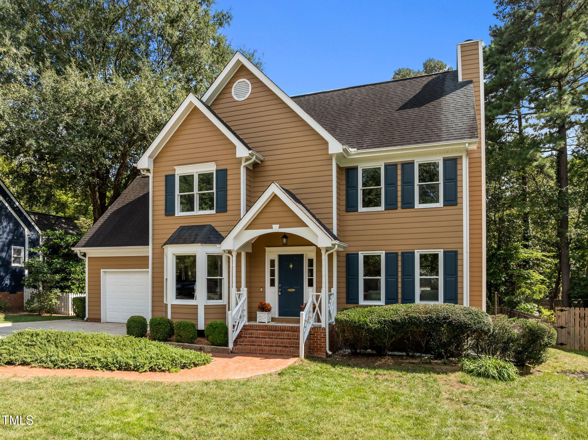 5909 Stable Court Raleigh, NC 27612 - Photo 4 of 45 a front view of a house with a yard