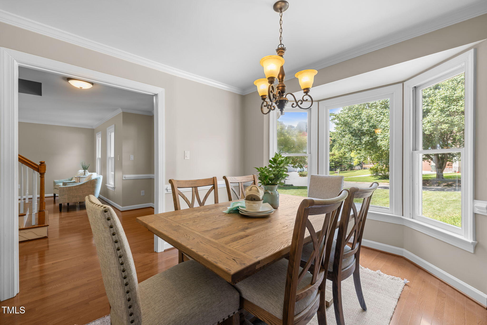 5909 Stable Court Raleigh, NC 27612 - Photo 7 of 45 a view of a dining room with furniture window and wooden floor
