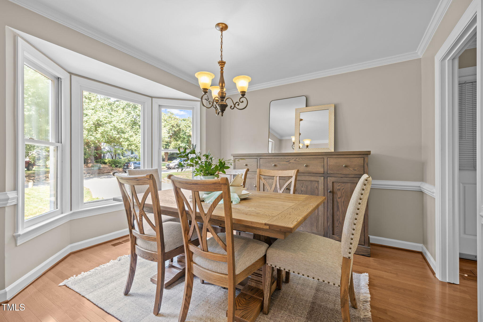 5909 Stable Court Raleigh, NC 27612 - Photo 8 of 45 a view of a dining room with furniture window and wooden floor