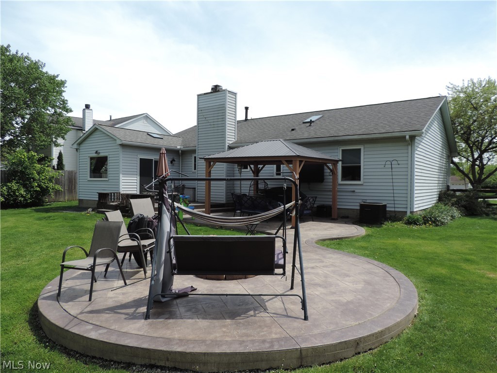 24770 Maple Ridge Road Westlake, OH 44145 - Photo 24 of 26 Back of house featuring a gazebo, a yard, and a patio