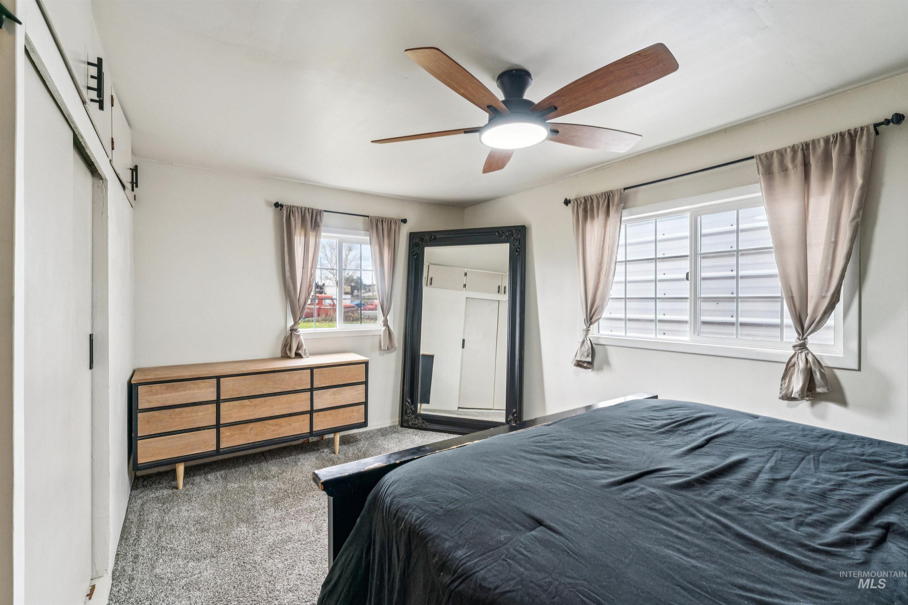 948 South Mill Road Emmett, ID 83617 - Photo 15 of 38 Carpeted bedroom with ceiling fan