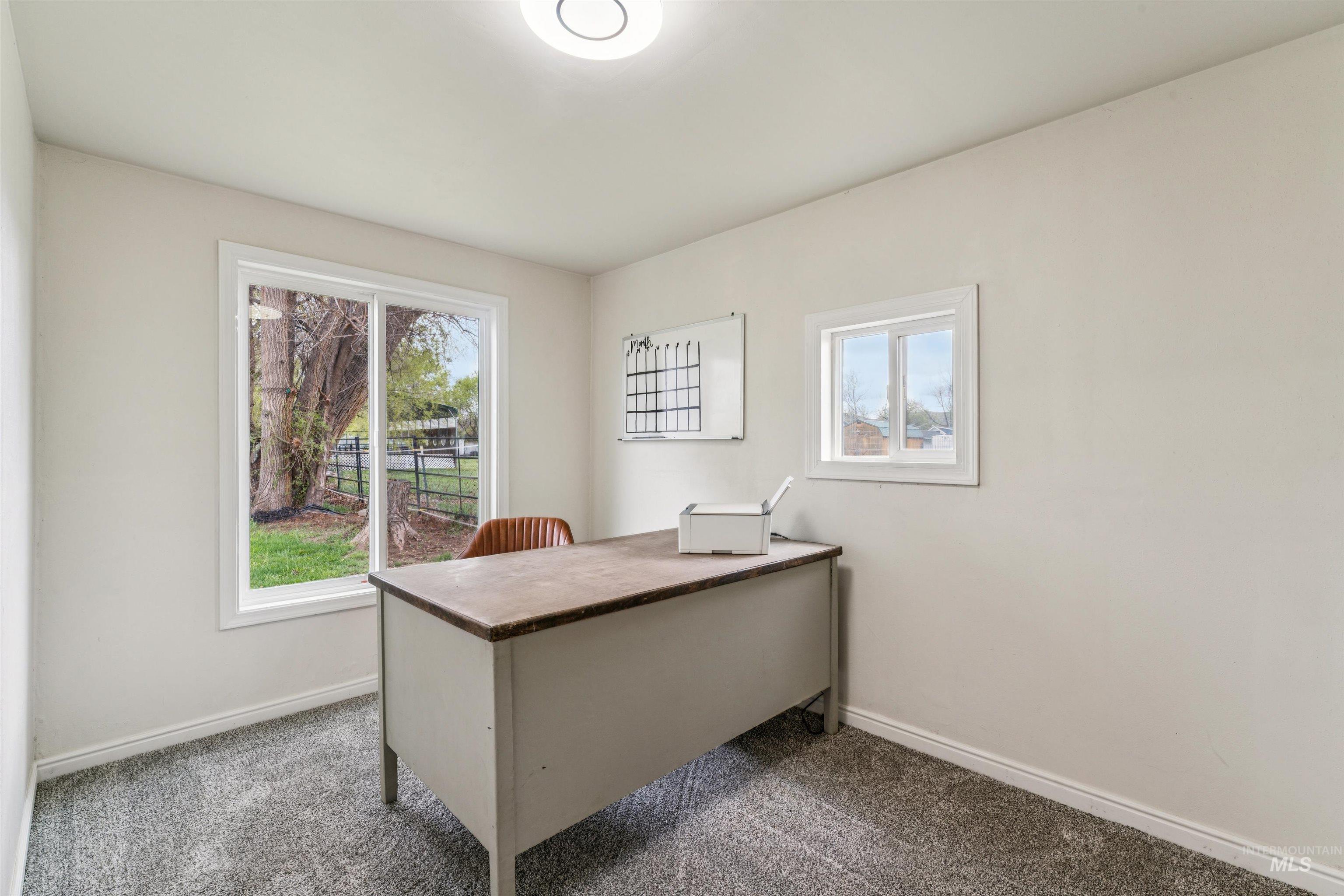 948 South Mill Road Emmett, ID 83617 - Photo 18 of 38 Office area featuring carpet and healthy amount of natural light