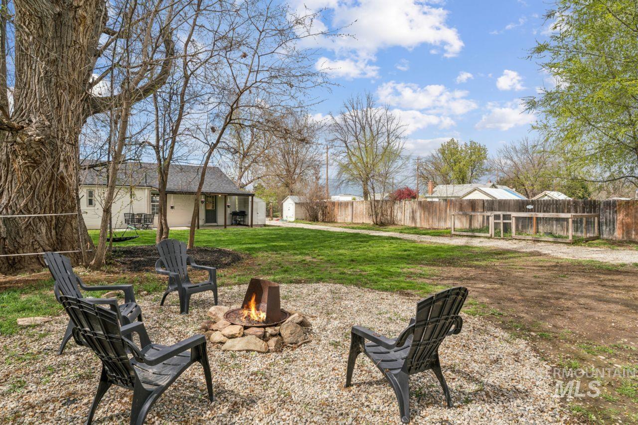 948 South Mill Road Emmett, ID 83617 - Photo 27 of 38 Fenced backyard featuring a storage shed and a patio