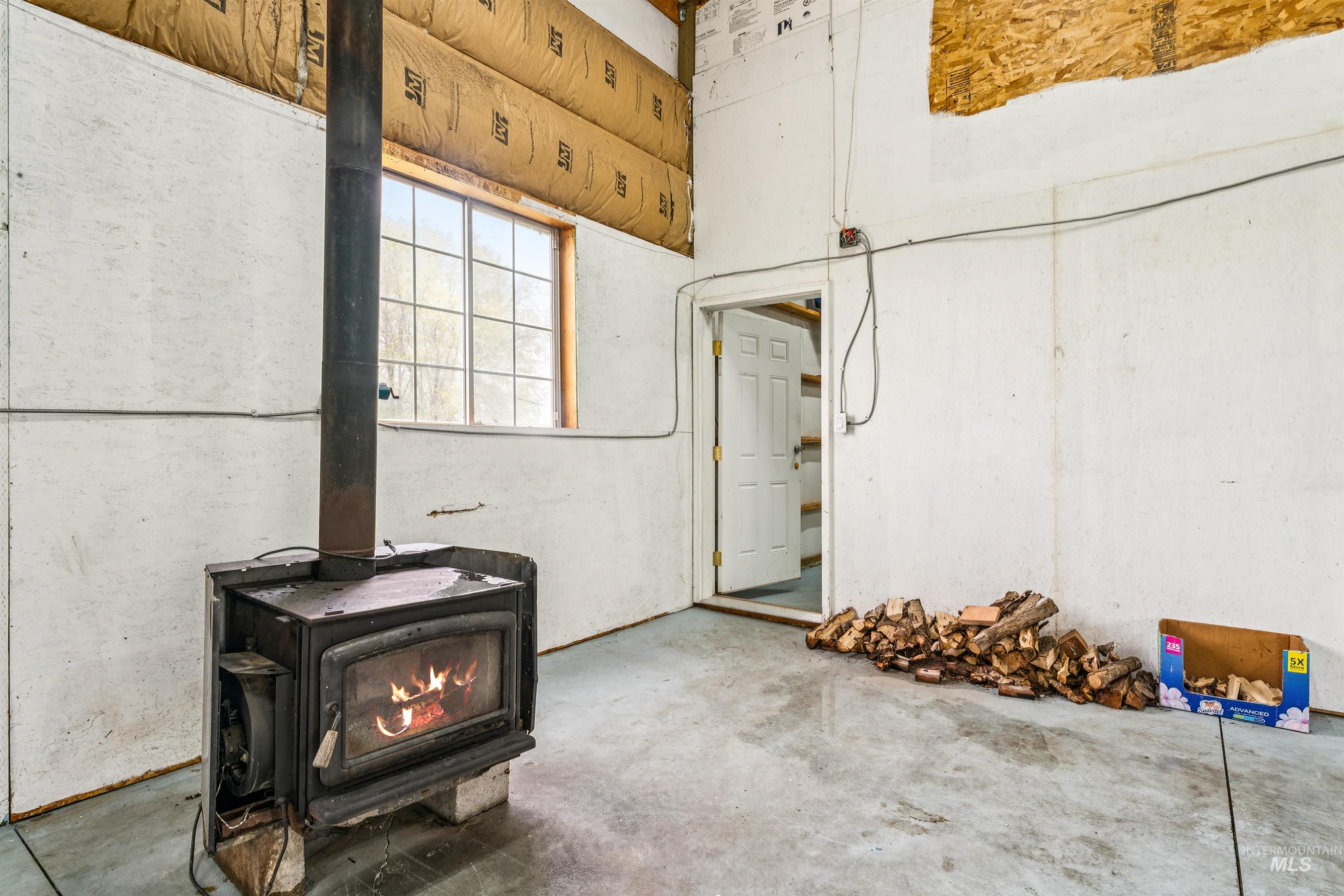 948 South Mill Road Emmett, ID 83617 - Photo 32 of 38 Basement featuring a wood stove