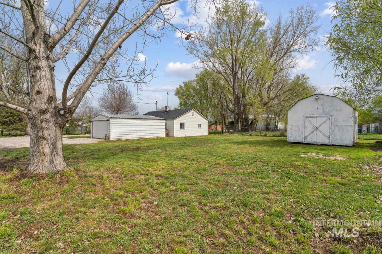948 South Mill Road Emmett, ID 83617 - Photo 4 of 38 View of yard featuring a garage and a shed