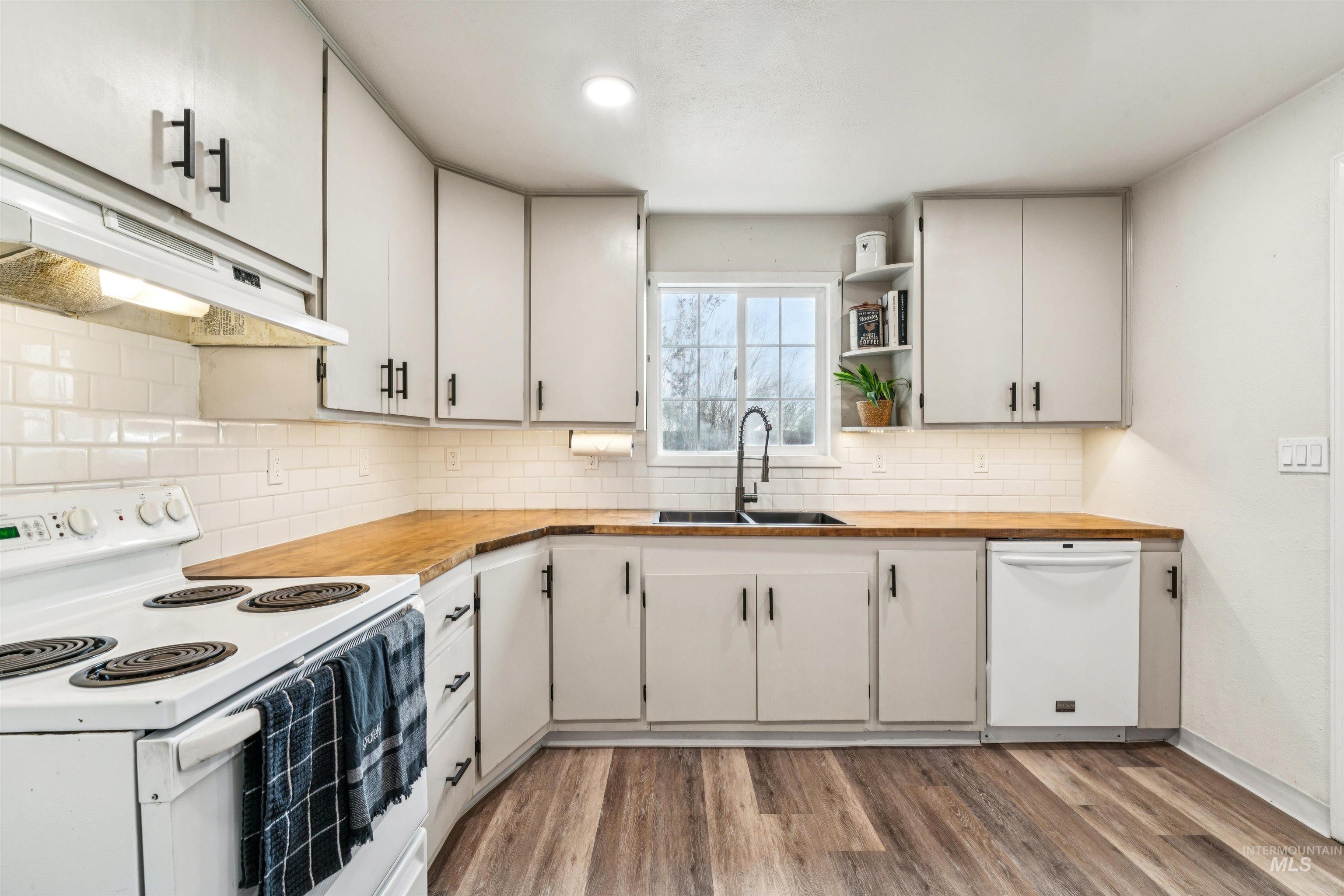 948 South Mill Road Emmett, ID 83617 - Photo 10 of 38 Kitchen featuring white appliances, butcher block counters, open shelves, light wood-type flooring, and recessed lighting