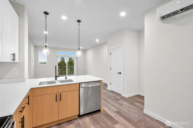 a bedroom with a bed and a potted plant