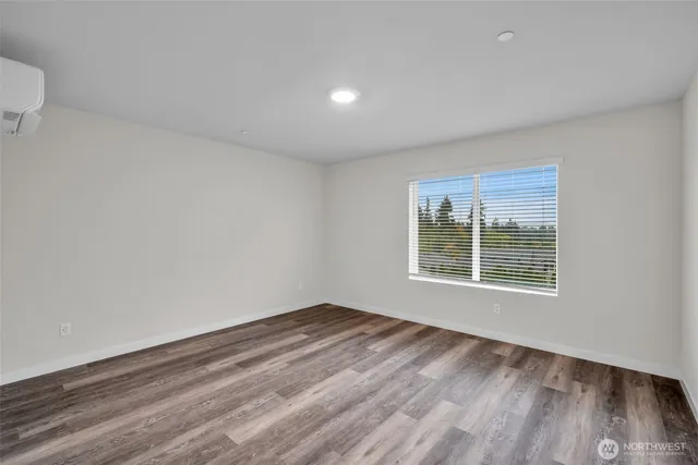 a bathroom with a sink vanity mirror and toilet